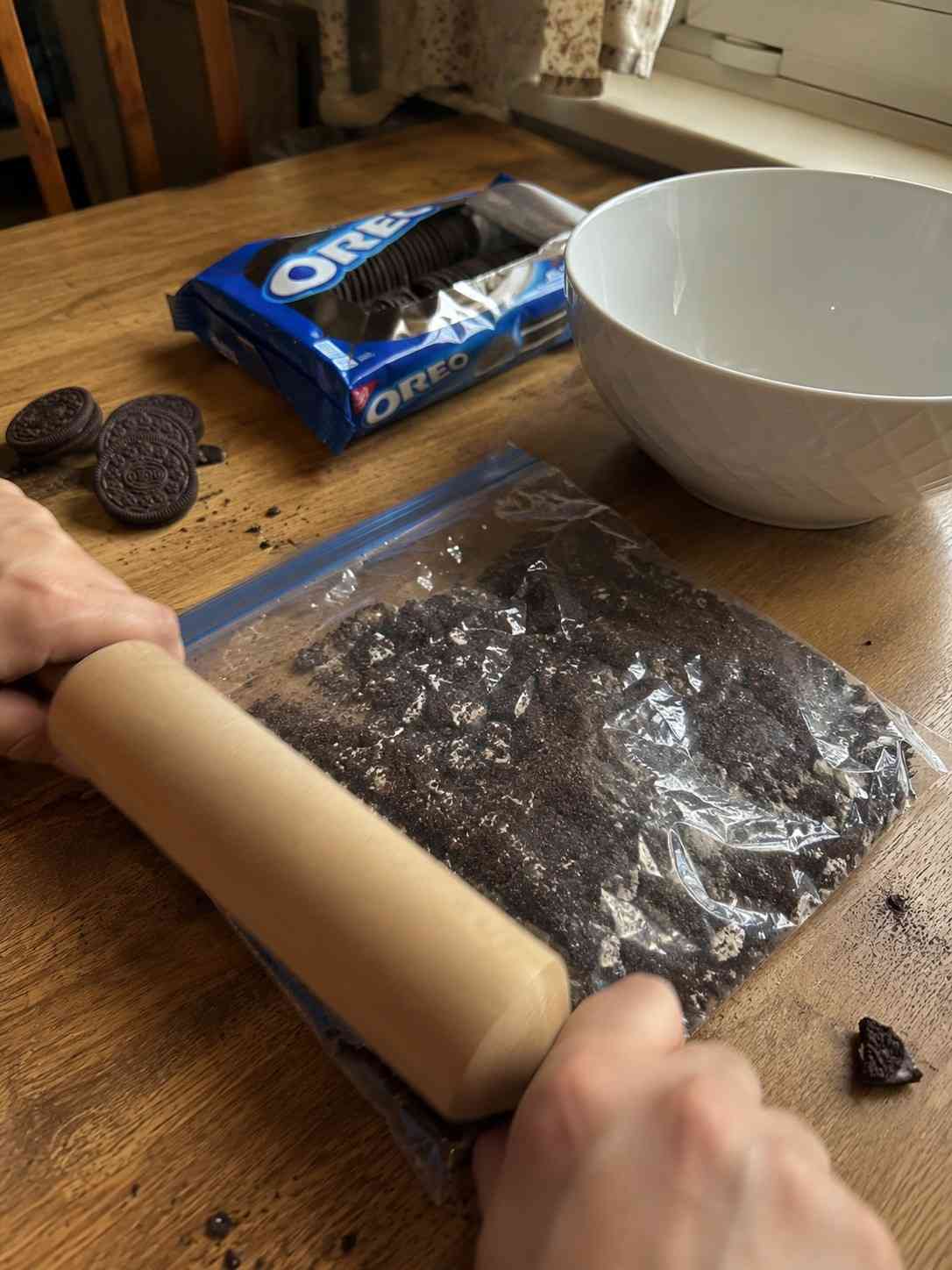 Crushing Oreo cookies for Oreo Fantasy Cake