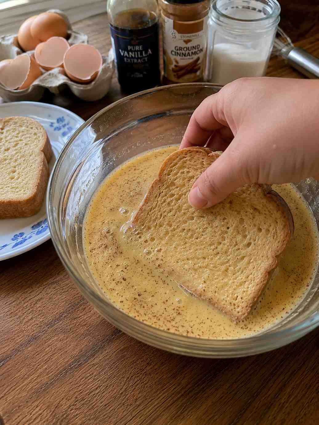 Bread soaking in French Toast mixture