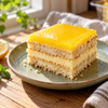Slice of lemon tiramisu with lemon curd swirl and mascarpone cream layers